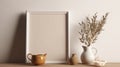 Breakfast still life. Cup of coffee, books and empty picture frame mockup on wooden desk, table. Vase with olive branches. Elegant Royalty Free Stock Photo