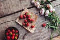 Breakfast with strawberries and flowers on the rustic table. Healthy breakfast, Clean eating, vegan food concept. Royalty Free Stock Photo