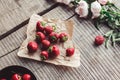 Breakfast with strawberries and flowers on the rustic table. Healthy breakfast, Clean eating, vegan food concept. Royalty Free Stock Photo