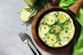 Breakfast. Summer omelet with zucchini and herbs on a stone or slate table Royalty Free Stock Photo