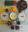 Breakfast table with bagels, oranges and other fresh vegetables Royalty Free Stock Photo