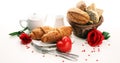 Breakfast on table with bread buns, croissants, coffe and juice on valentines day Royalty Free Stock Photo