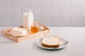 Breakfast table with bread slice, butter, milk and honey Royalty Free Stock Photo