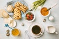 Breakfast table. Coffee, eggs, buns, juice and jam. Blue background, top view, food flat lay Royalty Free Stock Photo