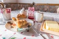 breakfast table with coffee sugar milk and butter and roll covered with euro coins and banknotes on plate, Germany Royalty Free Stock Photo