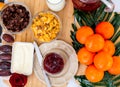 Breakfast on the table. Corn flakes, milk, butter, strawberry jam, bread, coffee, tea and fruit on a beautiful wooden tray for Royalty Free Stock Photo