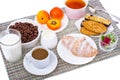 Breakfast table with croissant, muesli, milk, honey and fruits Royalty Free Stock Photo