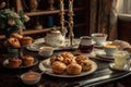 breakfast table, filled with muffins and scones, and tea cup for 2 Royalty Free Stock Photo