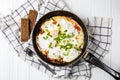 Breakfast on the table: a fried egg in frying pan Royalty Free Stock Photo