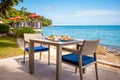 Breakfast table full of food at seaside restaurant, with sea view Royalty Free Stock Photo