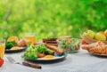 Breakfast table with healthy food. fried eggs, salad, croissants