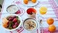 Breakfast on the table, juice, cereal and fruits in the sun. Goo Royalty Free Stock Photo