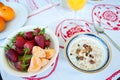 Breakfast on the table, juice, cereal and fruits in the sun. Goo Royalty Free Stock Photo