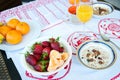 Breakfast on the table, juice, cereal and fruits in the sun. Goo Royalty Free Stock Photo