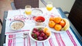 Breakfast on the table, juice, cereal and fruits in the sun. Goo Royalty Free Stock Photo