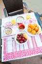 Breakfast on the table, juice, cereal and fruits in the sun. Goo Royalty Free Stock Photo