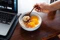 Breakfast on the table oats and oranges and granola