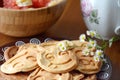 Breakfast table: pancakes, fruit salad and chamomile flowers