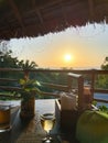 Breakfast table in rustic wooden terace patio of a a restaurant in Zanxibar at sunrise or sunset Royalty Free Stock Photo