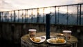 Breakfast table with served food with sunlight and cloudscape in the background Royalty Free Stock Photo
