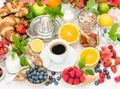 Breakfast table setting with coffee, croissants, granola. Health Royalty Free Stock Photo