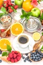 Breakfast table setting with coffee, croissants, granola, honey. Royalty Free Stock Photo