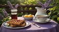 Delicious Waffles with Berries, Tea, and Peaches Served Outdoors in Summer. Royalty Free Stock Photo