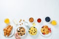 Breakfast table setting with flakes, juice, croissants, pancakes Royalty Free Stock Photo