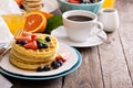 Breakfast table with stack of waffles