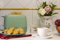 Breakfast table with toasted bread, cookies, coffee and fresh flowers Royalty Free Stock Photo