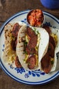 Breakfast tacos with kielbasa sausage tacos, eggs and cilanro