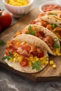 Breakfast tacos with scrambled eggs and bacon