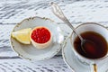 breakfast with tartlets with red caviar and coffee on wooden table Royalty Free Stock Photo