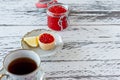 Breakfast with tartlets with red caviar and coffee on wooden table Royalty Free Stock Photo