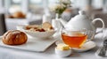Breakfast with tea, pastry, oatmeal on a white table setting. Royalty Free Stock Photo
