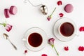 Breakfast tea on white table with roses and macaroons for two. Vallentines day and romance concept. Flat lay Royalty Free Stock Photo