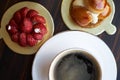 Breakfast time with cup og hot coffee and pieces of cream cake Royalty Free Stock Photo