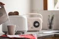 Breakfast time with electric kettle, toaster and an old vintage radio