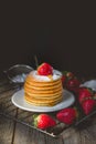 Breakfast Time with Fresh Strawberry on Stack of Pancake Pouring