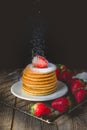 Breakfast Time with Fresh Strawberry on Stack of Pancake Sprinkled with sugar Royalty Free Stock Photo