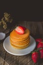 Breakfast Time with Fresh Strawberry on Stack of Pancake , Wooden Background with Copy Space