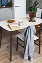 Breakfast time and kitchen place with coffee mug on wooden desk with opened book