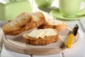 Breakfast toast and butter on cutting board