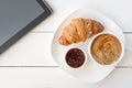 Breakfast with touchpad tablet Royalty Free Stock Photo