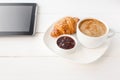 Breakfast with touchpad tablet Royalty Free Stock Photo