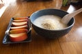 Breakfast traditional chinese food style rice porridge congee with herb vegetable and side dish apple fruits for thai people guest