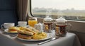 Breakfast on Train with Sandwiches and Tea by Window Royalty Free Stock Photo
