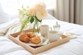 Breakfast Tray Arranged On White Bed