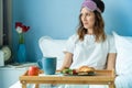 Breakfast on tray in bed for young beautiful funny woman Royalty Free Stock Photo