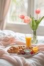 Breakfast tray with croissants and juice on a bed., Generated AI